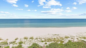 A beach with clear skies and calm waters.