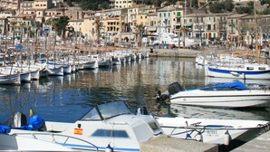 A marina with boats docked, surrounded by buildings with balconies and a clear blue sky. - Stunning, romantic 1 Bedroom Property With Terrace (Fornalutx)