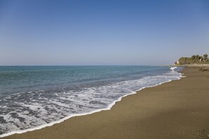 On the beach, sun-loungers, beach towels