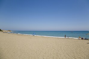On the beach, sun-loungers, beach towels