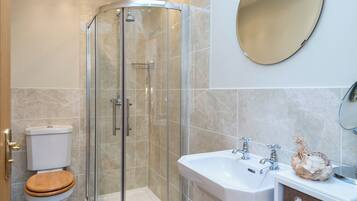 Bathtub, hair dryer, towels, soap