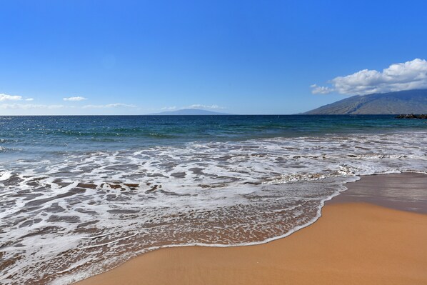 On the beach, sun loungers, beach towels