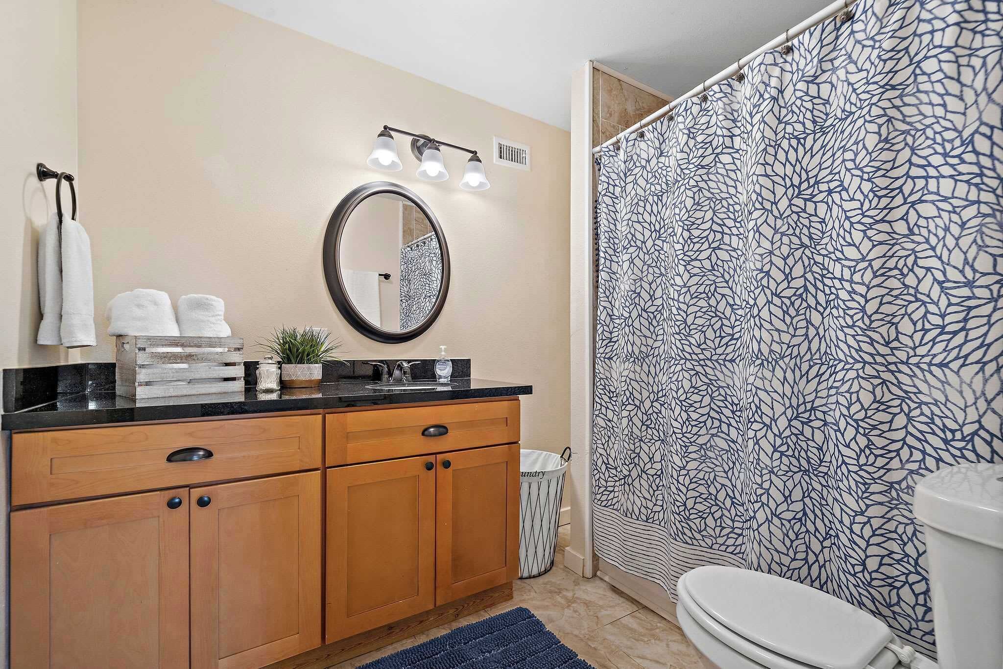 Bathroom Bliss: Modern fixtures and soothing decor make your retreat refreshing and inviting!