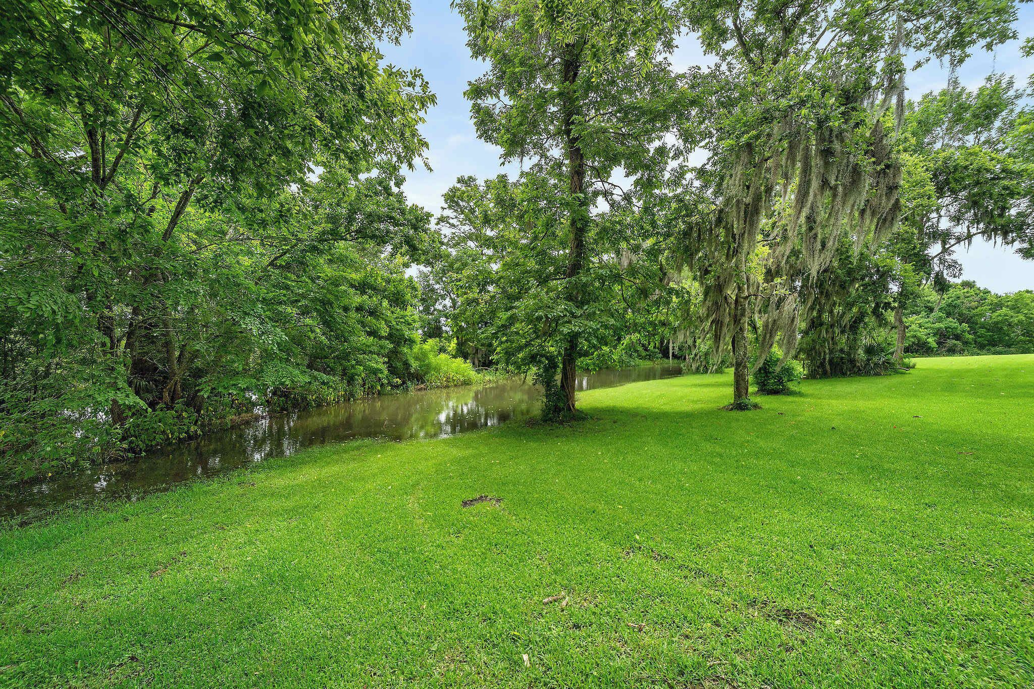 Serene Outdoor Oasis: Embrace nature with lush greenery and tranquil water views just steps away!
