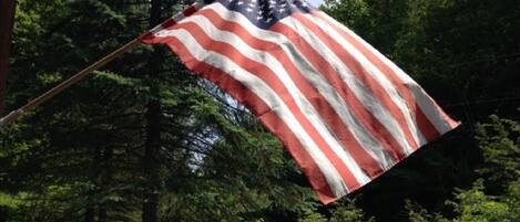 An American flag waving in the wind.