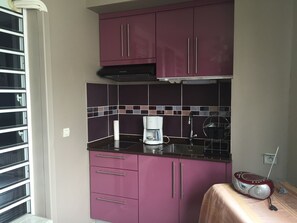 Fridge, microwave, stovetop, coffee/tea maker