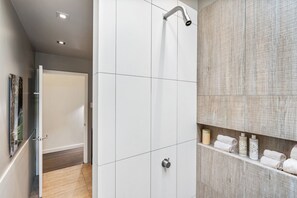 Bathtub, hair dryer, towels, soap