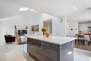 Enjoy cooking in this well-equipped kitchen with an oven, microwave, and ample counter space.