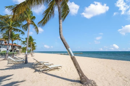 Private beach, sun-loungers, beach towels. Villa Steps From The Sand