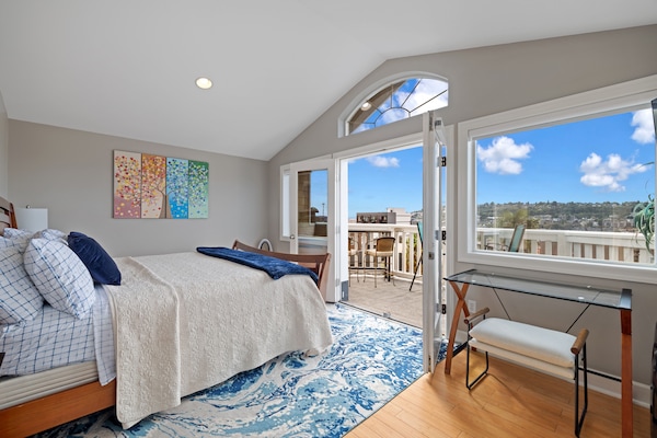 The primary suite has French doors leading to stunning panoramic views. A/C