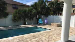 A rectangular swimming pool with a brick patio. - Steps to the non-driving section of the beach!  (Saint Augustine Beach)