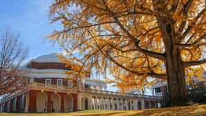 A large building with a dome and arched windows, surrounded by trees with autumn leaves. - Staybridge Suites Charlottesville Airport by IHG (Charlottesville)