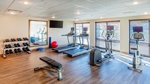 A gym with treadmills, a bench, dumbbells, and a stationary bike. - Staybridge Suites Charlottesville Airport by IHG (Charlottesville)