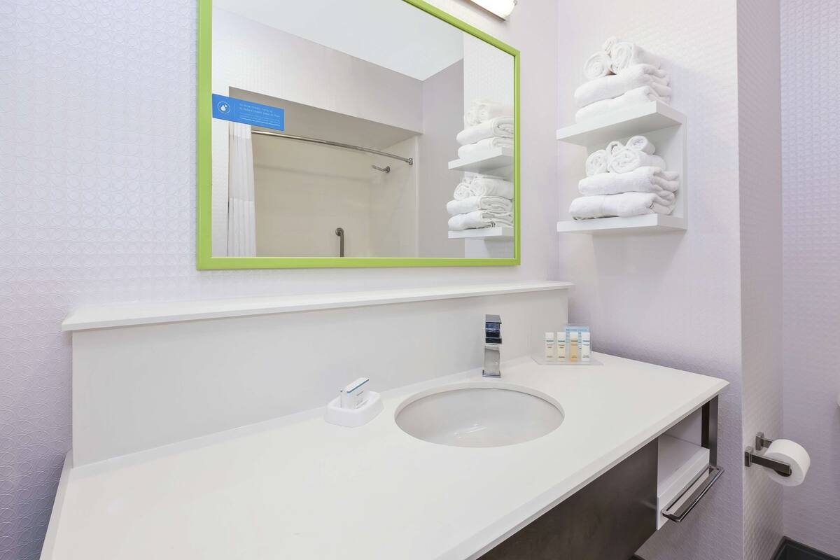 room, 2 queen beds, refrigerator | bathroom shower