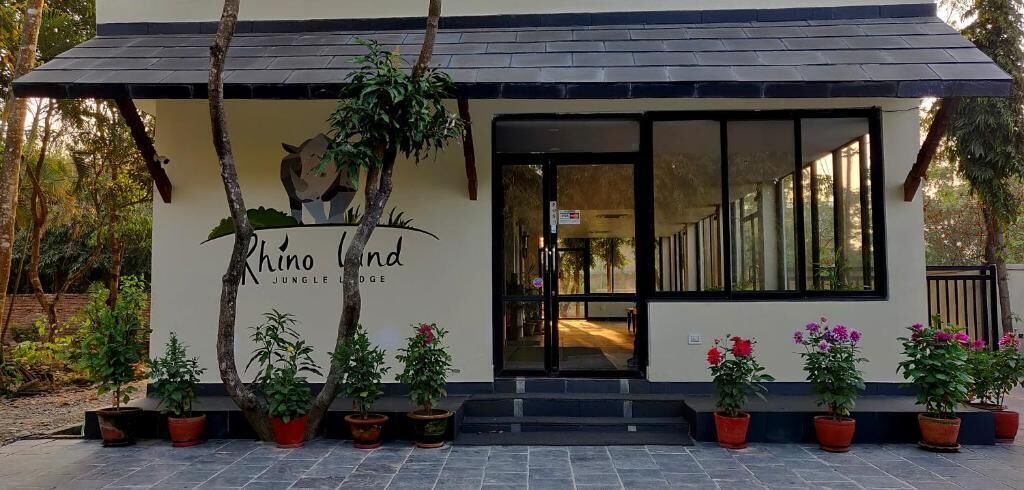 A building with a sign reading "Rhino Land Jungle Lodge".
