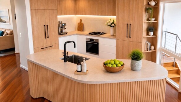 A modern kitchen with a central island, wooden cabinetry, and a built-in oven. - Dunescape Spacious Rye Retreat with Private Pool (RYE)