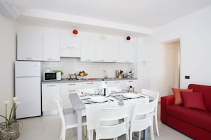 Apartment, 2 Bedrooms | Living area | Flat-screen TV