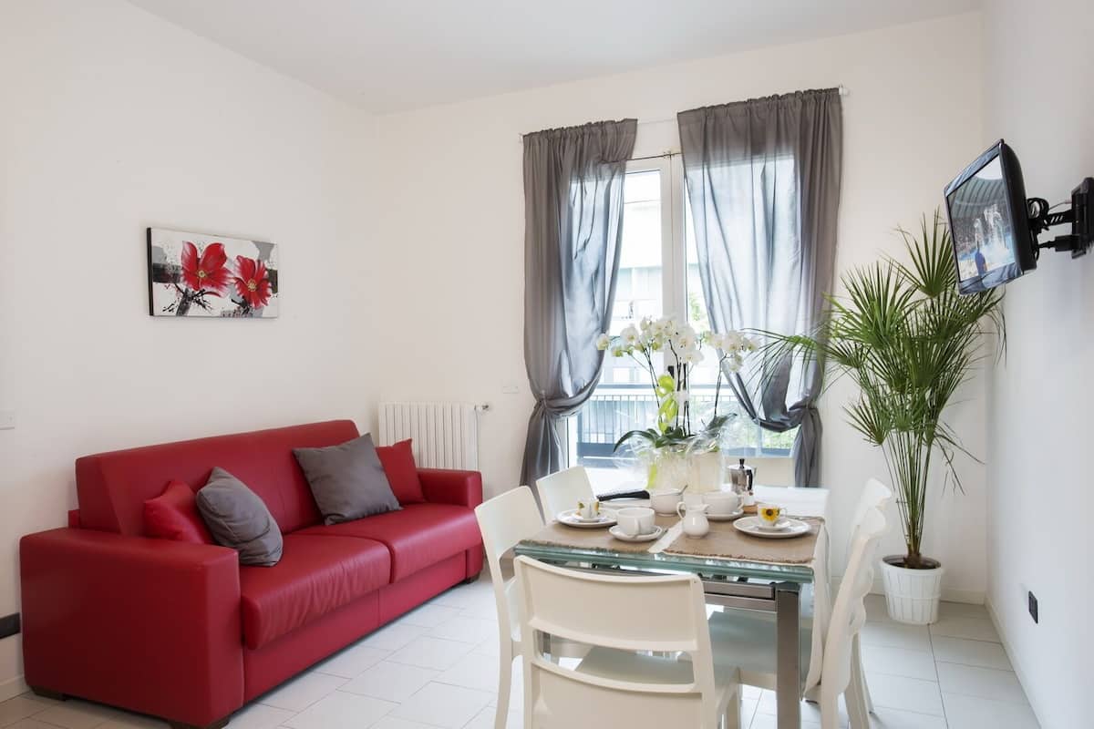 Apartamento, 1 quarto | Área de estar | TV de tela plana