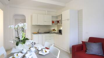 Apartment, 1 Bedroom | Living area | Flat-screen TV