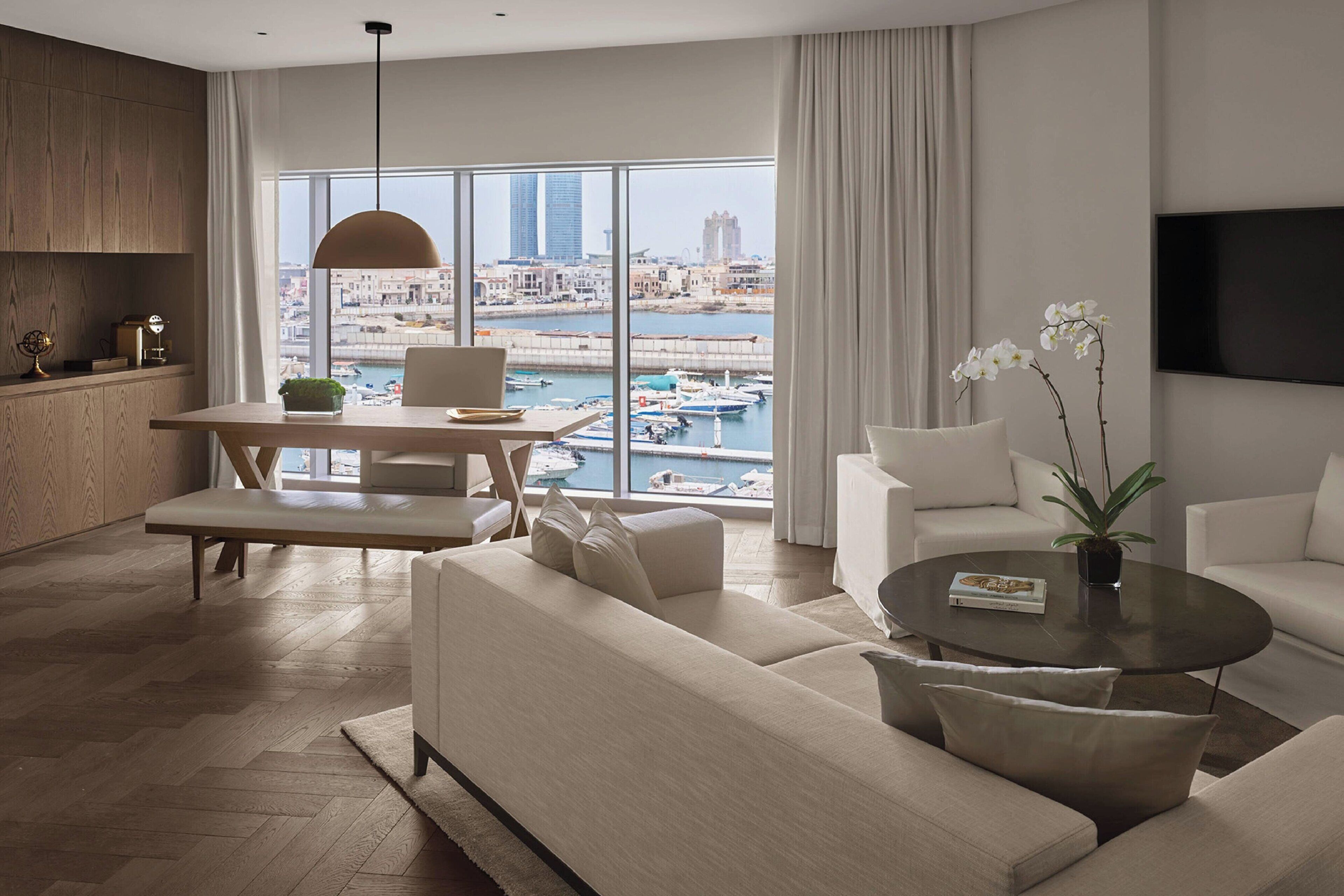 premier suite, 1 king bed, marina view | living room | 32-inch lcd tv with satellite channels, tv