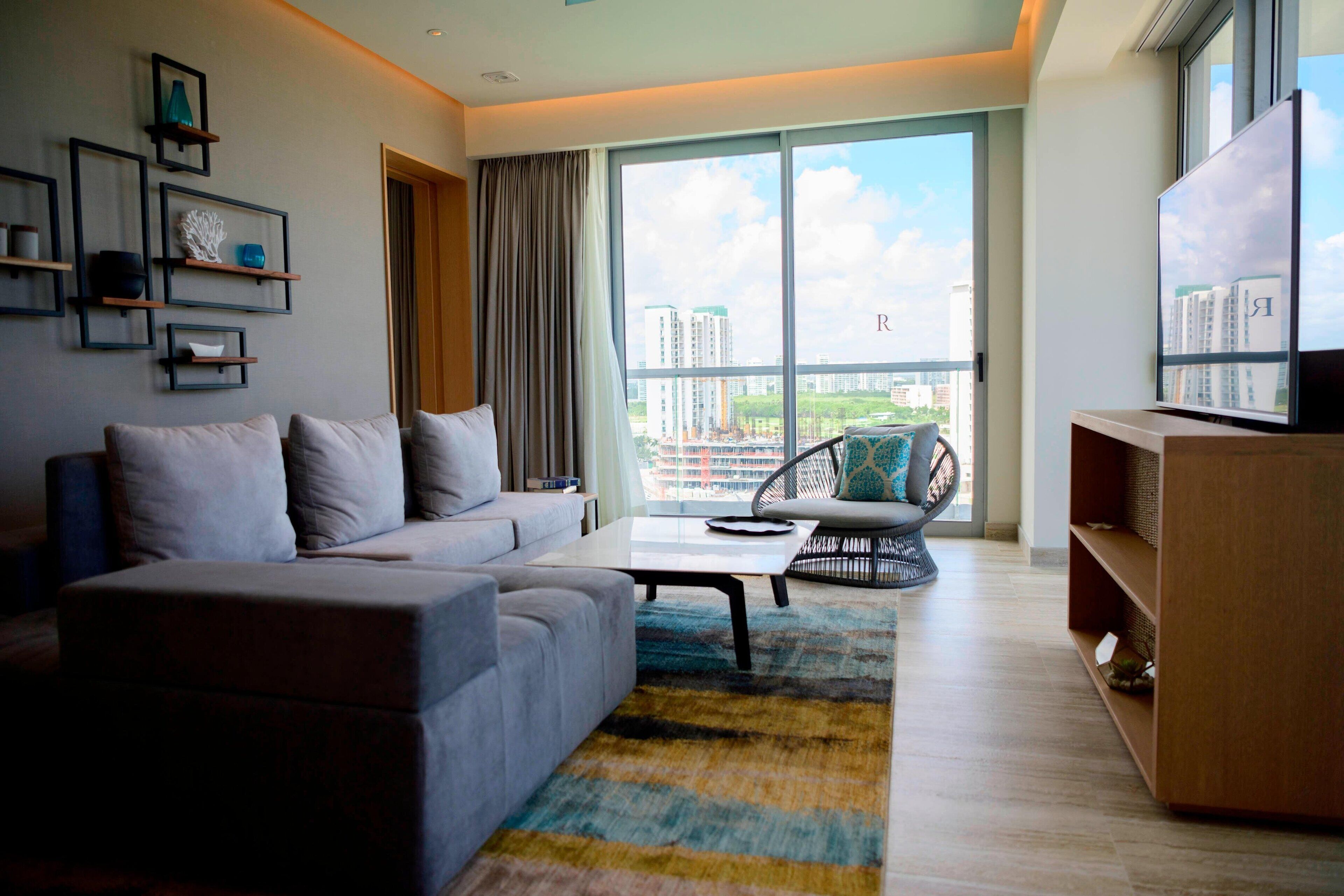 suite, 1 bedroom, non smoking, marina view (balcony) | living room | 65-inch lcd tv with satellite channels, tv