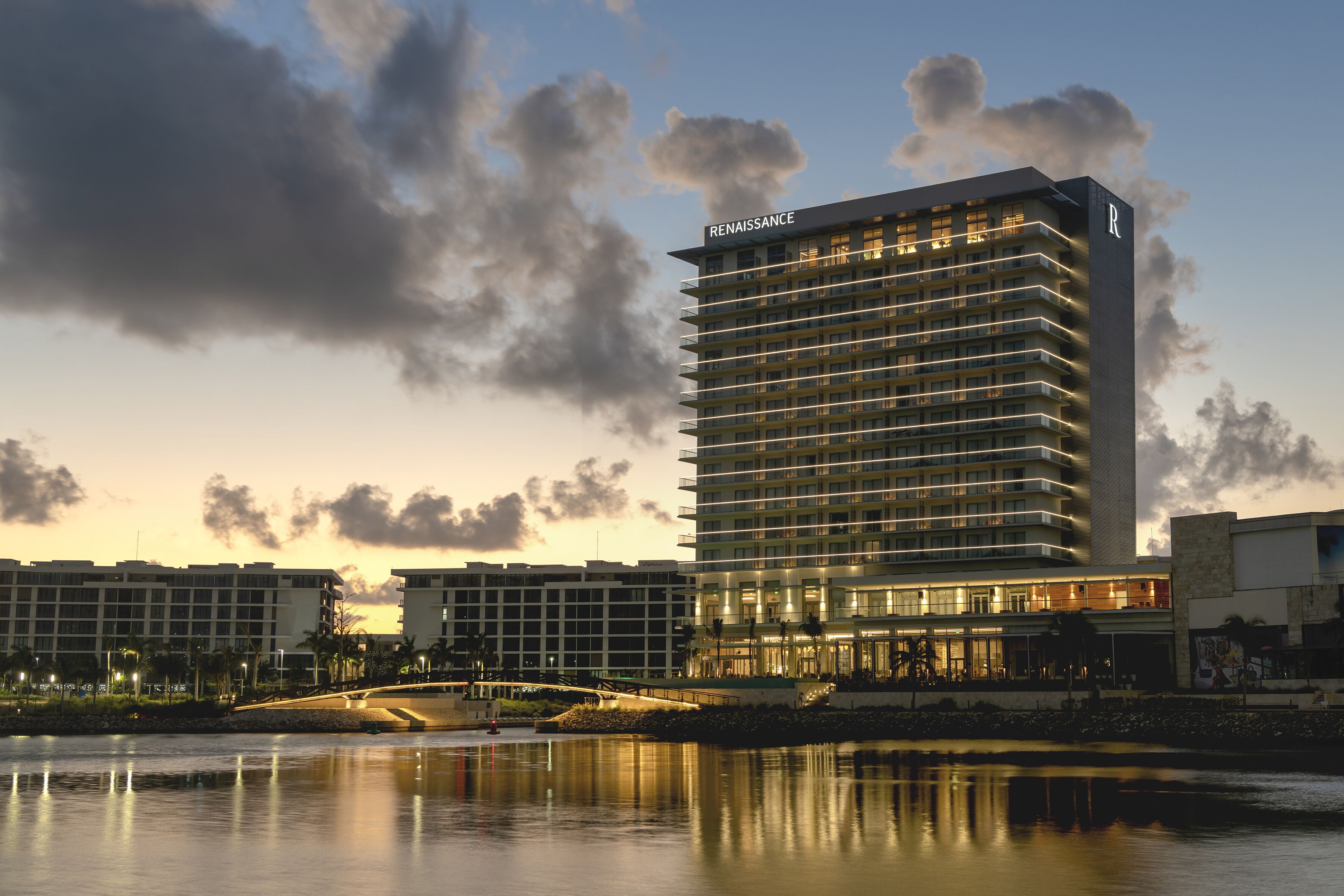 A high-rise hotel with a modern design, featuring balconies and a prominent 'Renaissance' sign.