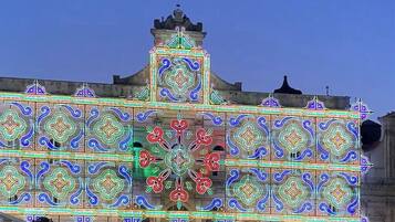 A building facade with intricate geometric patterns and a central decorative element.