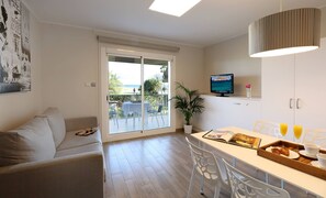 Premium Apartment, 1 Bedroom, Balcony, Sea View | Living area | Flat-screen TV - Aparthotel Solifemar (Castelldefels)