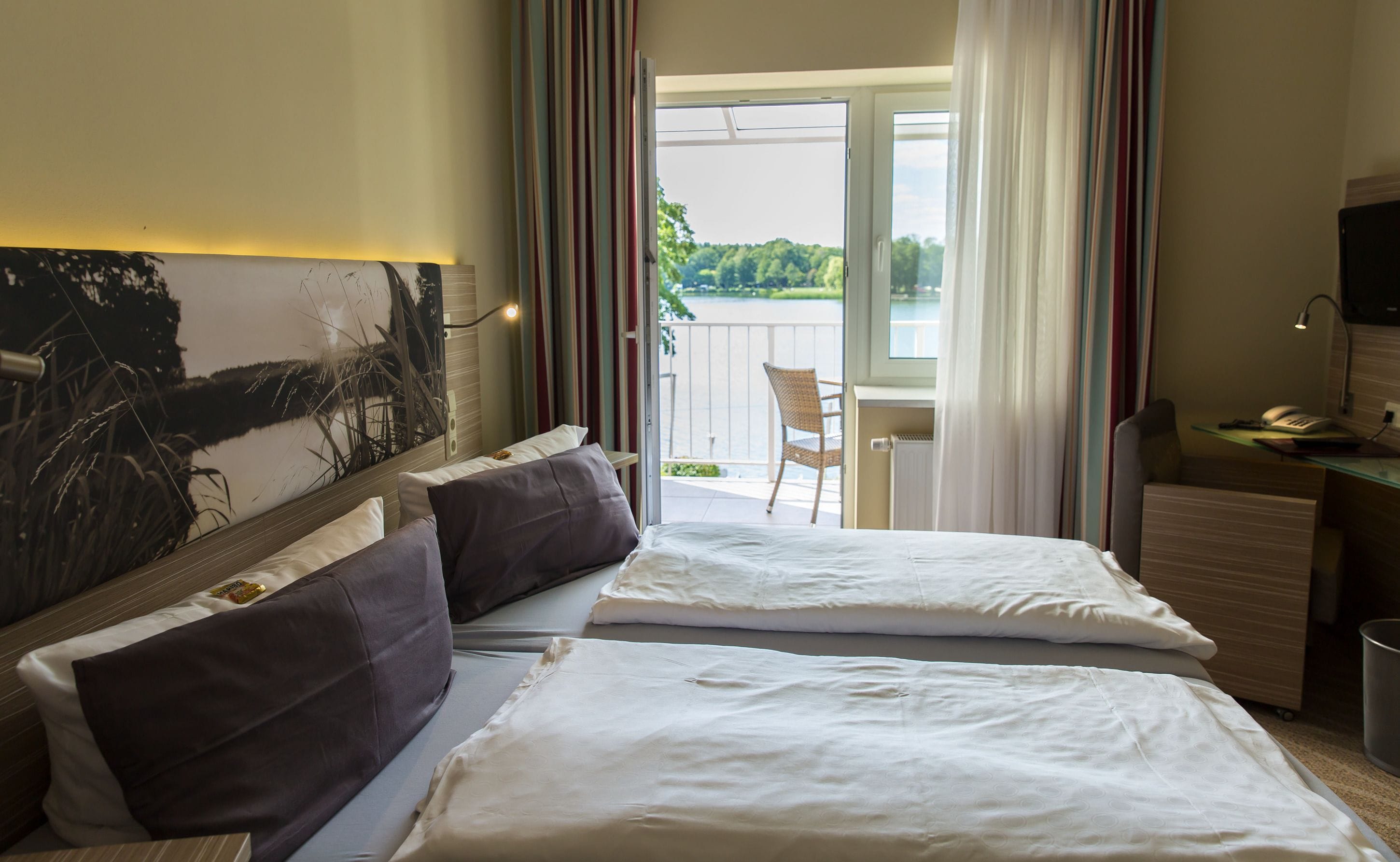 Double Room, Balcony, Lake View | Minibar, in-room safe, desk, blackout curtains