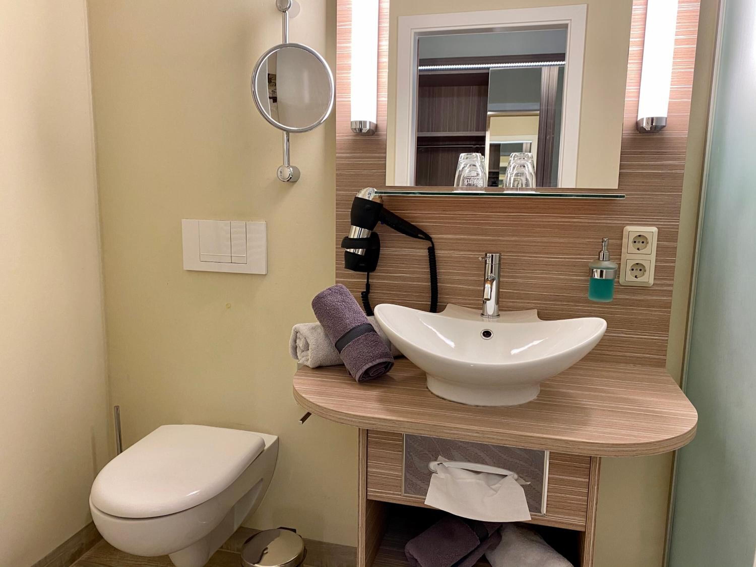 shower, rainfall showerhead, hair dryer, towels