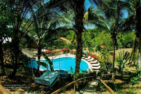 Outdoor pool. Al Hamra Jungle Resort - Adults Only