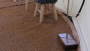 A tent with a dreamcatcher, two stools, and a table. - Le Moulin Du Luech - Bulles Insolites (Peyremale)