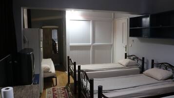 Premium bedding, desk, laptop workspace, iron/ironing board