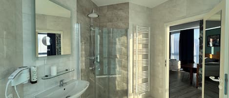 Shower, hair dryer, towels, shampoo