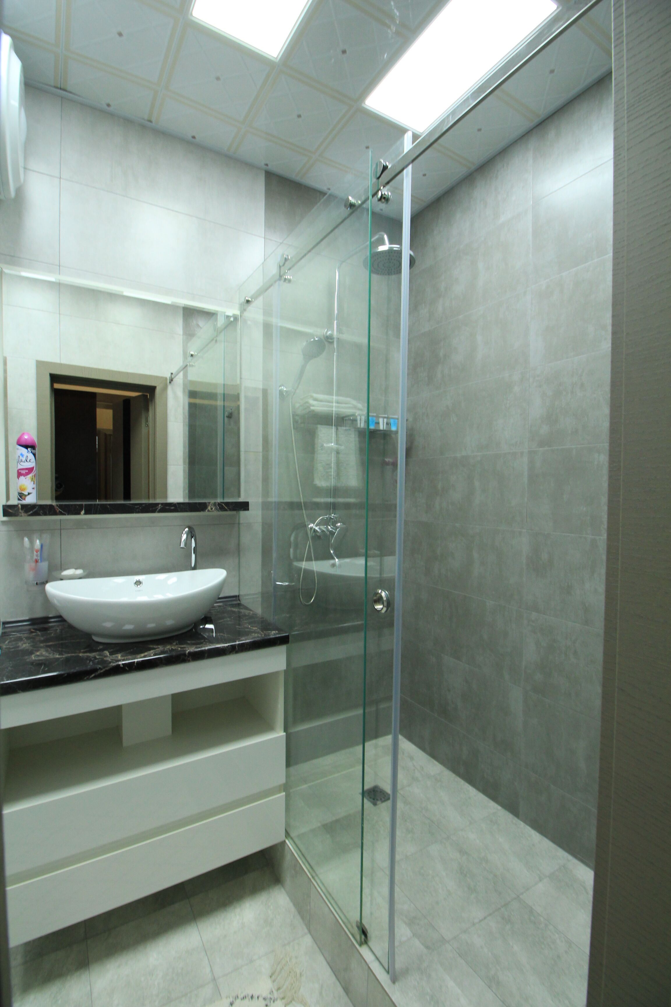 shower, bathrobes, slippers, towels