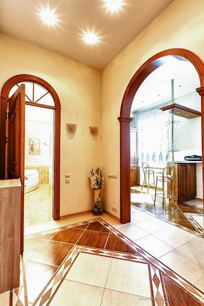 Experience the grandeur of this beautifully appointed space with high ceilings, archways, and elegant decor.