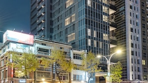 A multi-story hotel with a prominent sign reading "DOWNTREE." - DoubleTree by Hilton Taipei Zhongshan (Taipei)