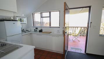 Family Apartment, 2 Bedrooms, Lake View (The Loft) | Private kitchenette | Fridge, microwave, stovetop, electric kettle
