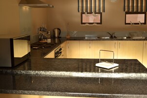 Family Apartment, 2 Bedrooms | Private kitchen | Fridge, toaster, cookware/dishes/utensils, cleaning supplies