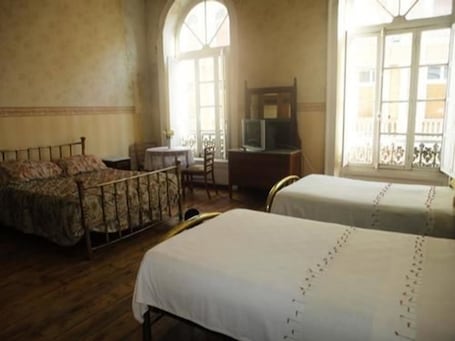 Family Room, Private Bathroom | Individually decorated, free WiFi, bed sheets. Hotel Garden