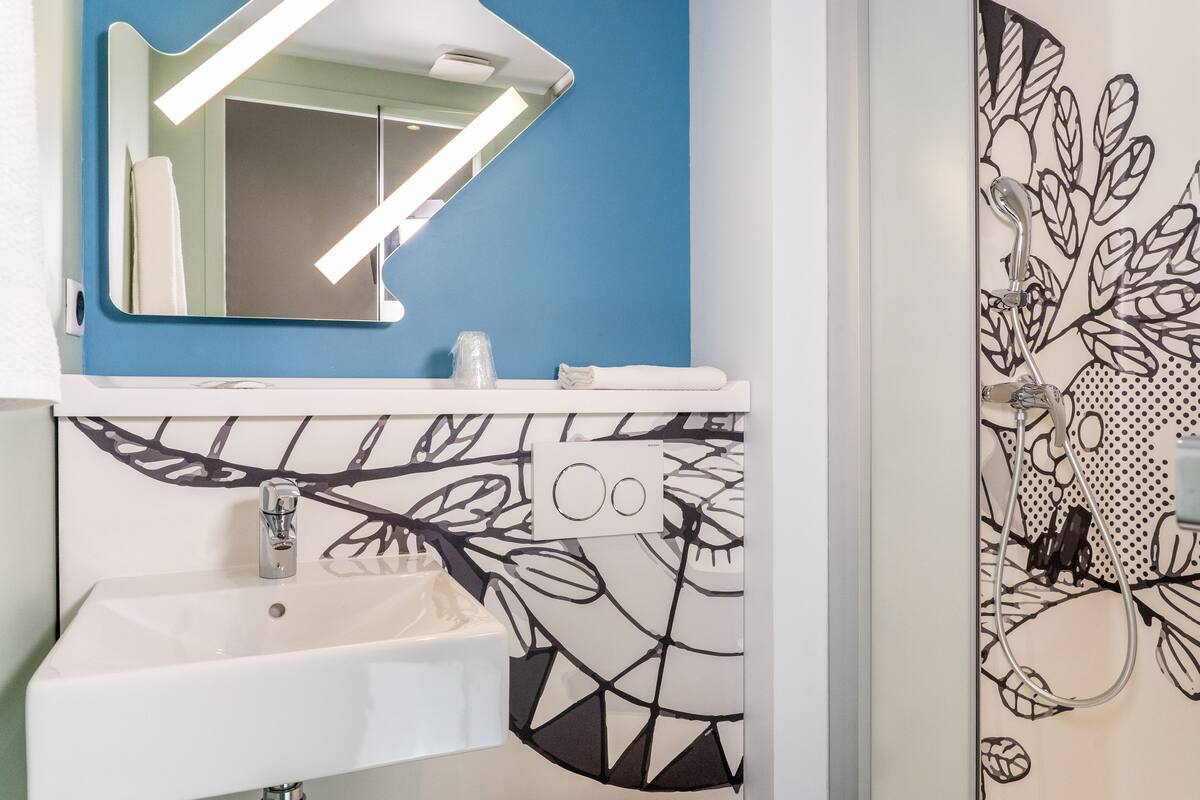 twin room, 2 single beds | bathroom | shower, eco-friendly toiletries, towels