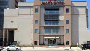 A multi-story building with a prominent 'Jack's Gym' sign at the top. - Room50two (Gaborone)