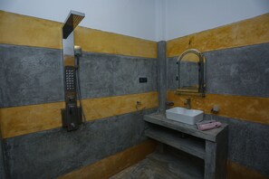Shower, designer toiletries, hair dryer, slippers
