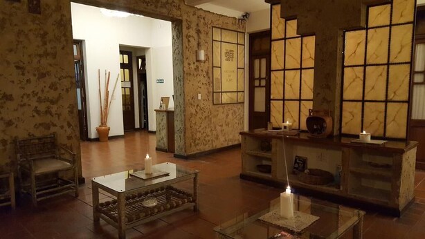 A traditional interior with tatami mats, a reception desk, and a tea ceremony setup. - Hotel Refugio del Inca (Salta)