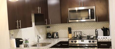 Premier Apartment, 1 King Bed | Private kitchen | Oven, stovetop, dishwasher, coffee/tea maker