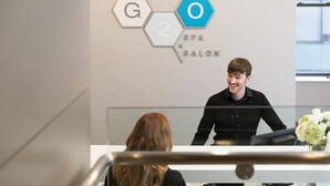 A reception desk with a sign indicating a spa salon. - Remarkable One Bedroom Suite (Boston)