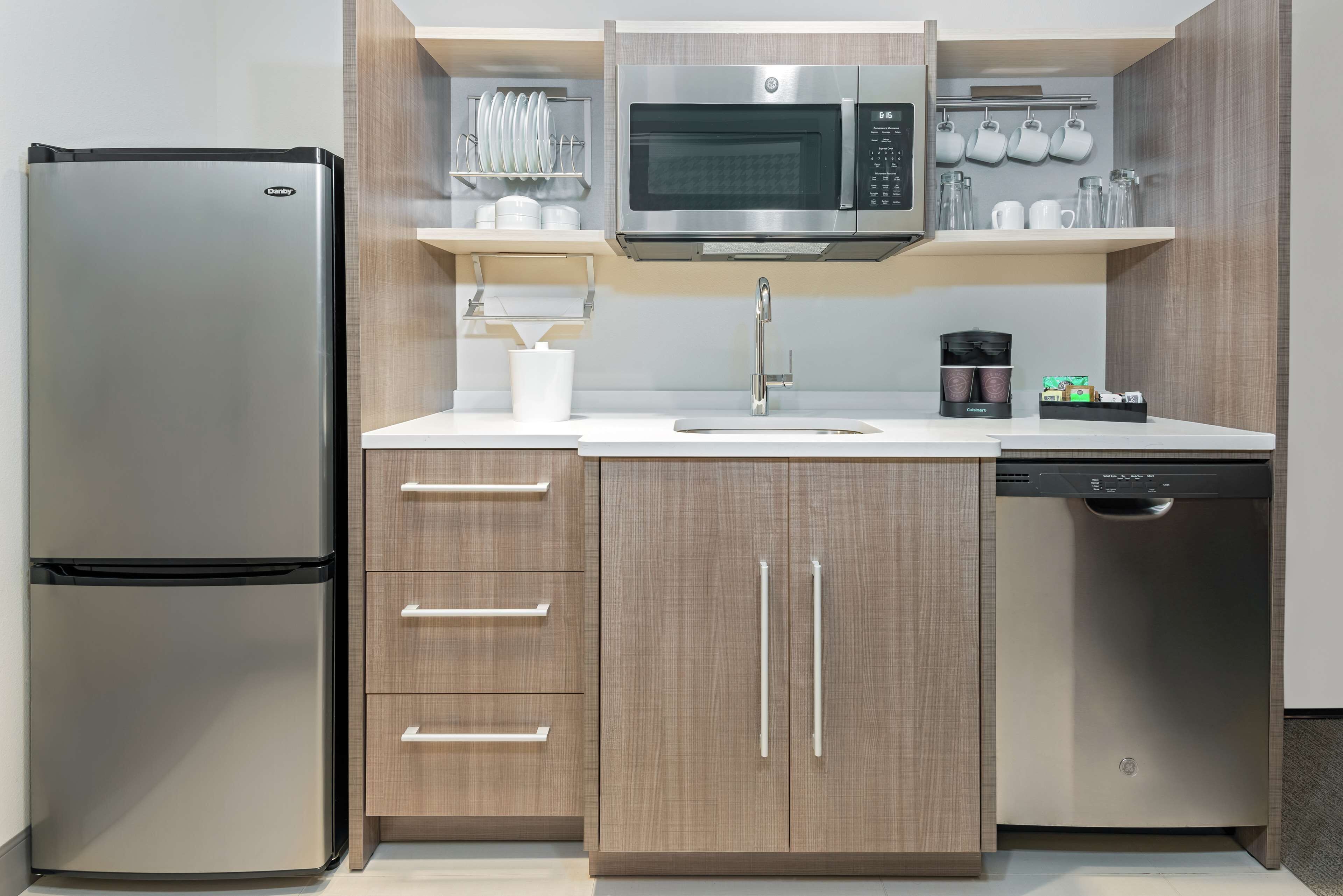 full-sized fridge, microwave, dishwasher, cookware/dishes/utensils