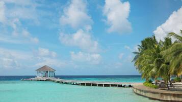 Private beach, white sand, sun loungers, beach umbrellas