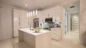 Luxury Penthouse, Ensuite, Partial Ocean View | Private kitchen | Coffee/tea maker, full-size fridge, microwave, oven - Amani Suite (Providenciales)