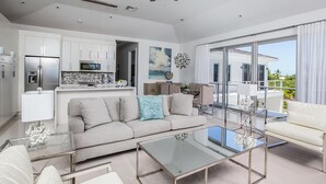 Luxury Penthouse, Ensuite, Partial Ocean View | Living room | Flat-screen TV, DVD player - Amani Suite (Providenciales)
